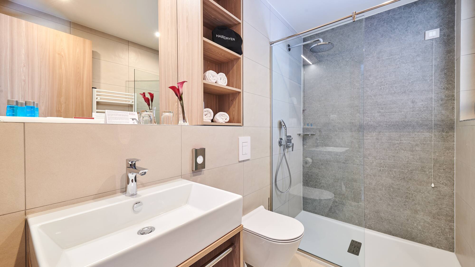 a bathroom with a shower and sink