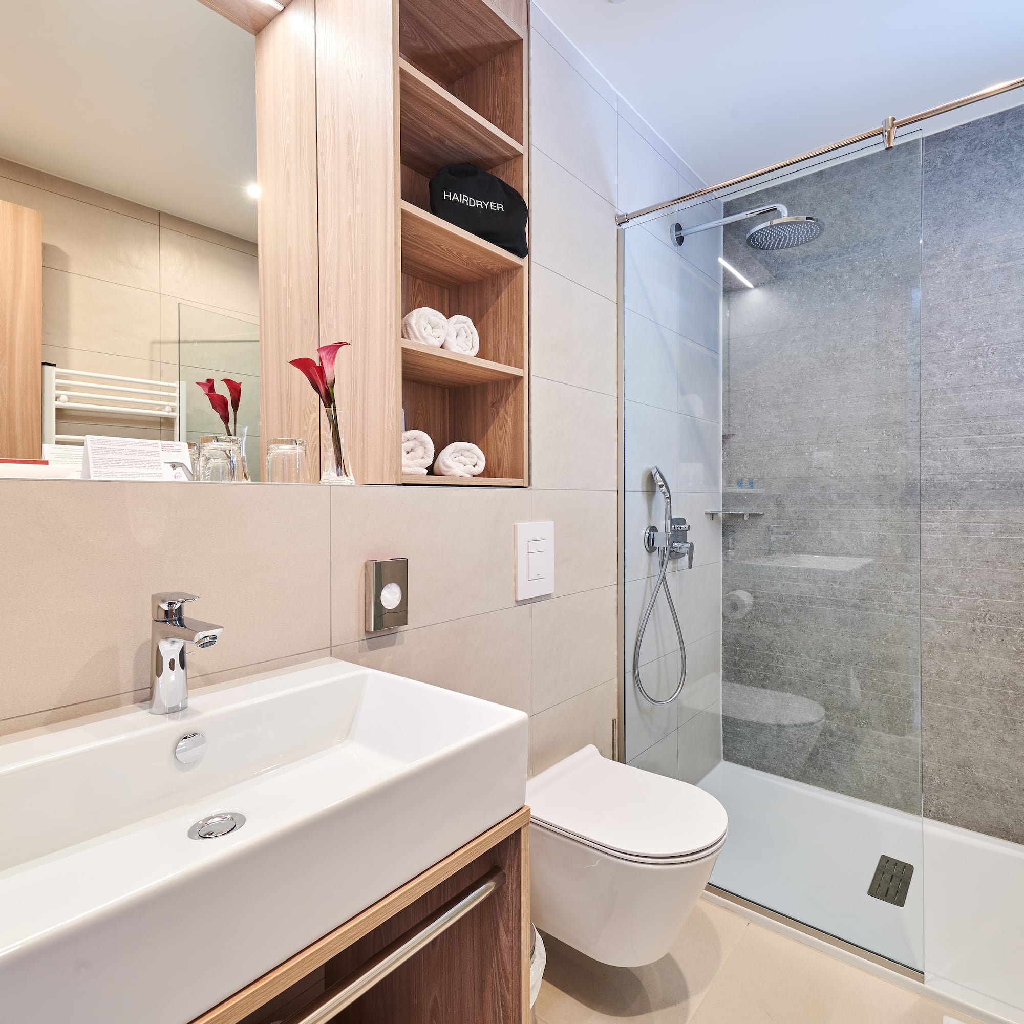 a bathroom with a shower and sink