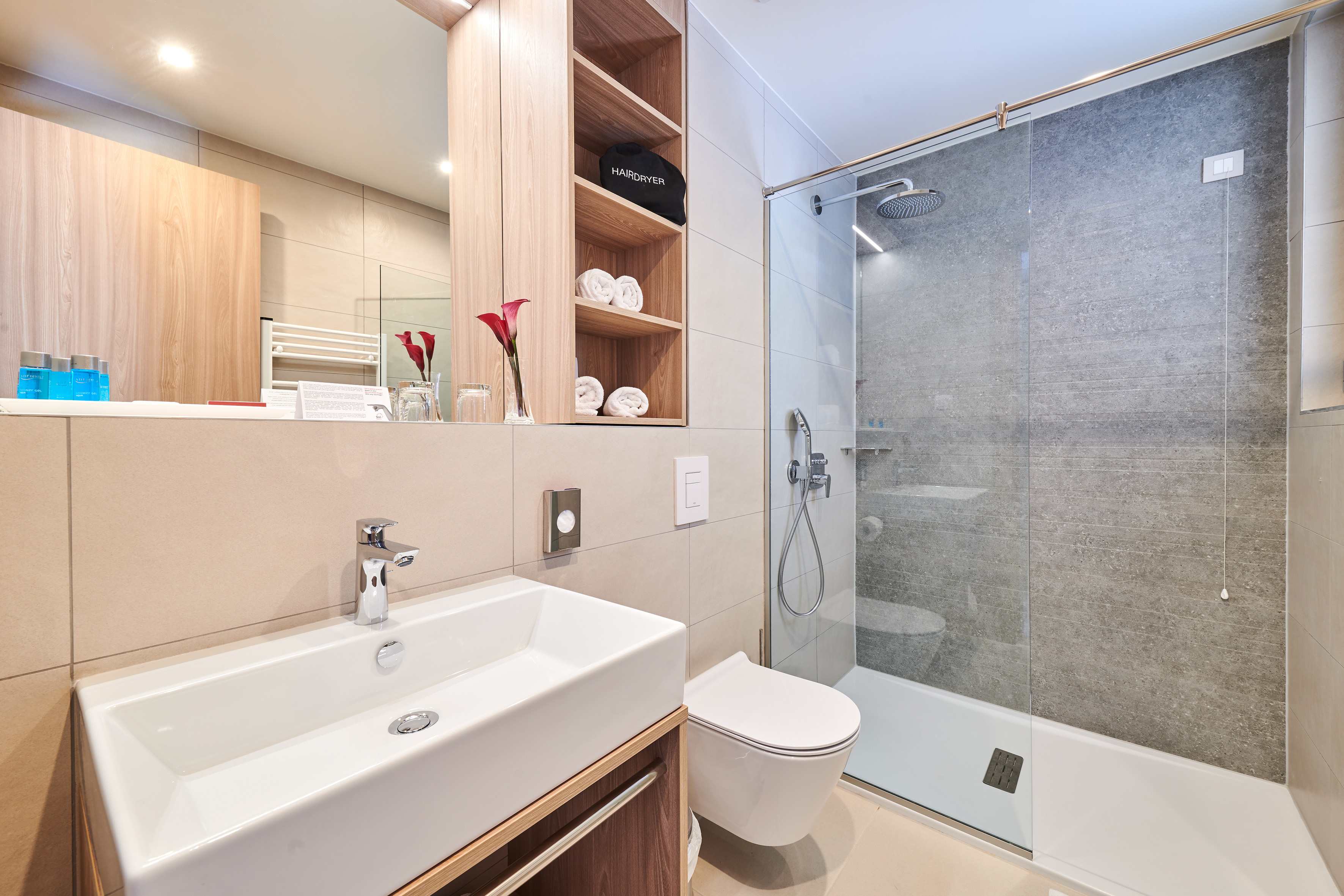 a bathroom with a shower and sink