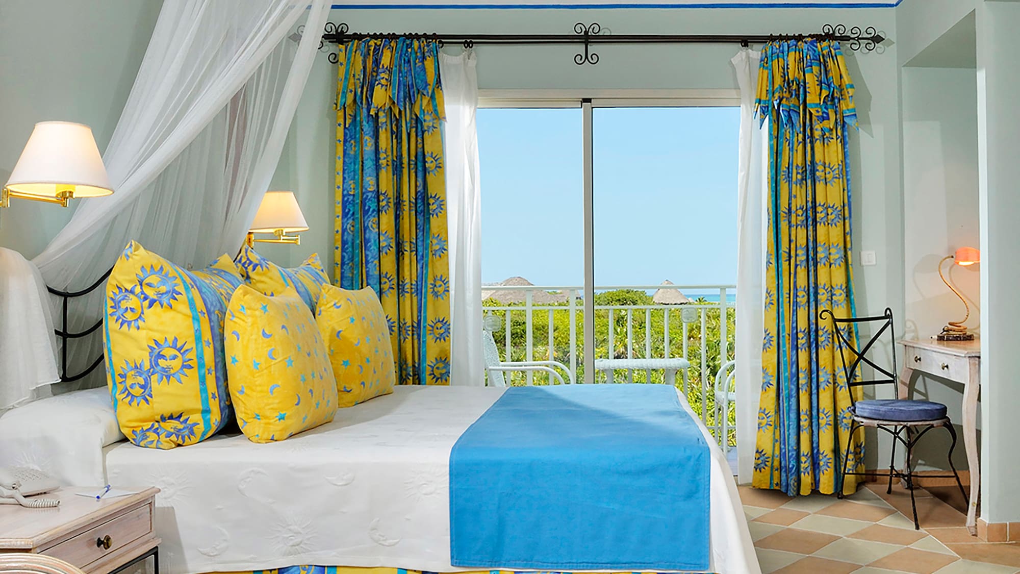 a bed with yellow and blue curtains