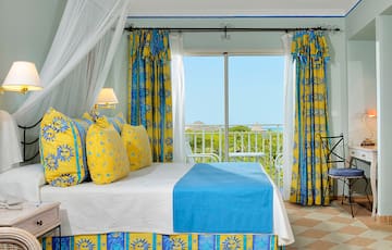 a bed with yellow and blue curtains