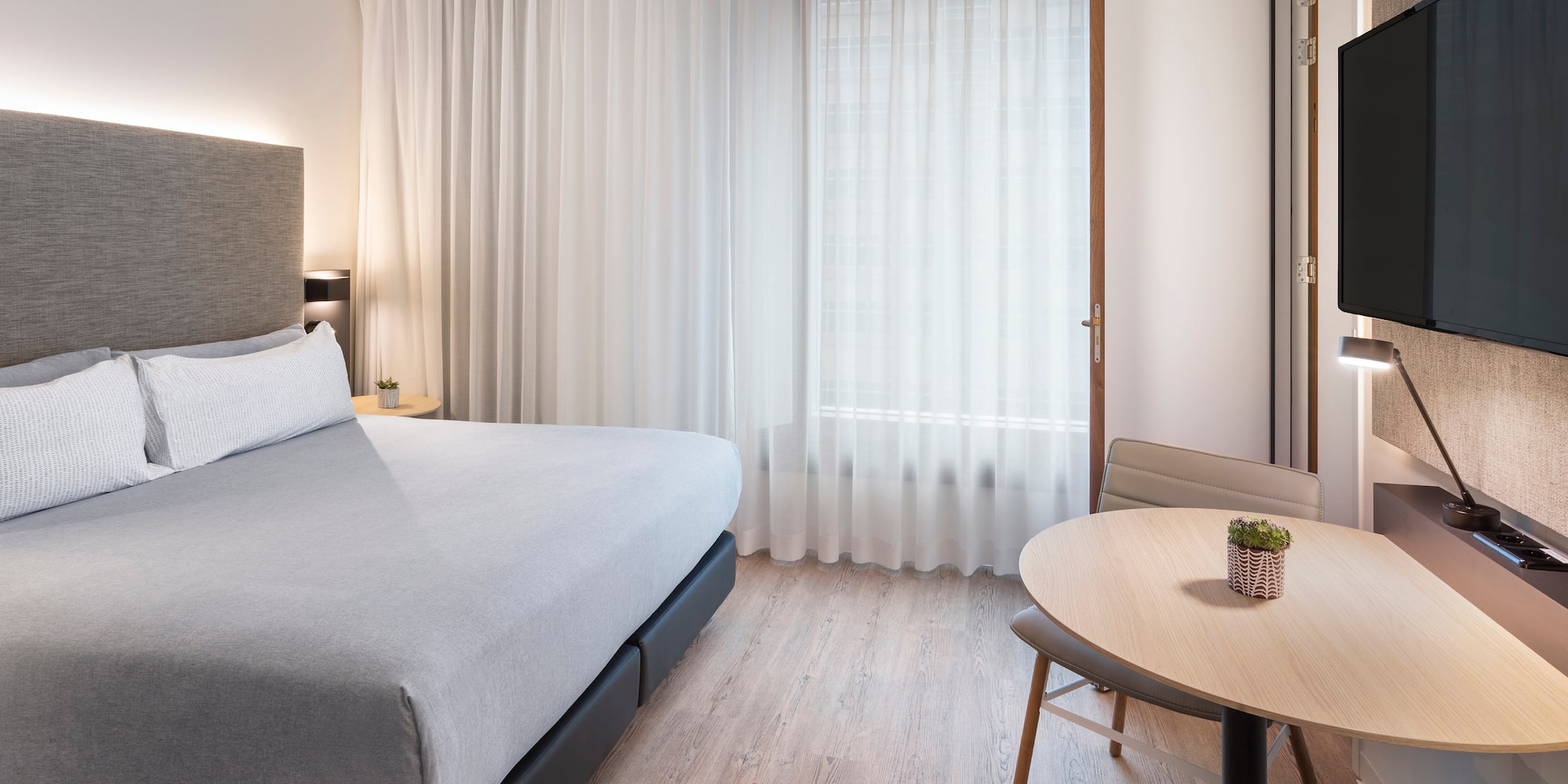 a room with a bed and a table