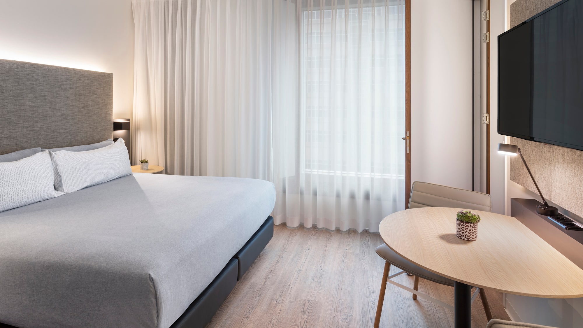 a room with a bed and a table