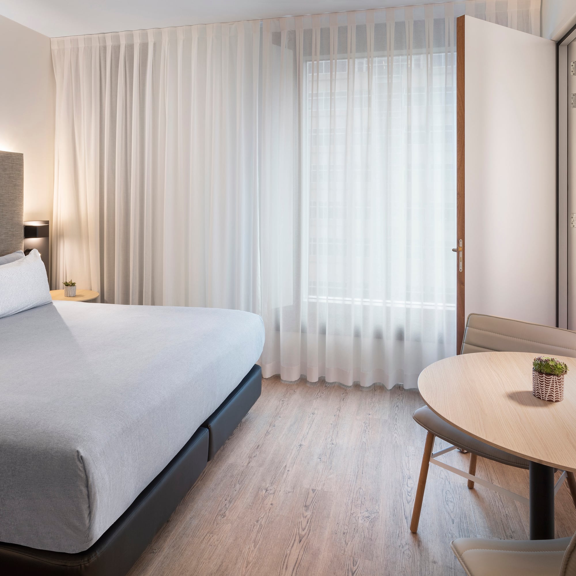 a room with a bed and a table