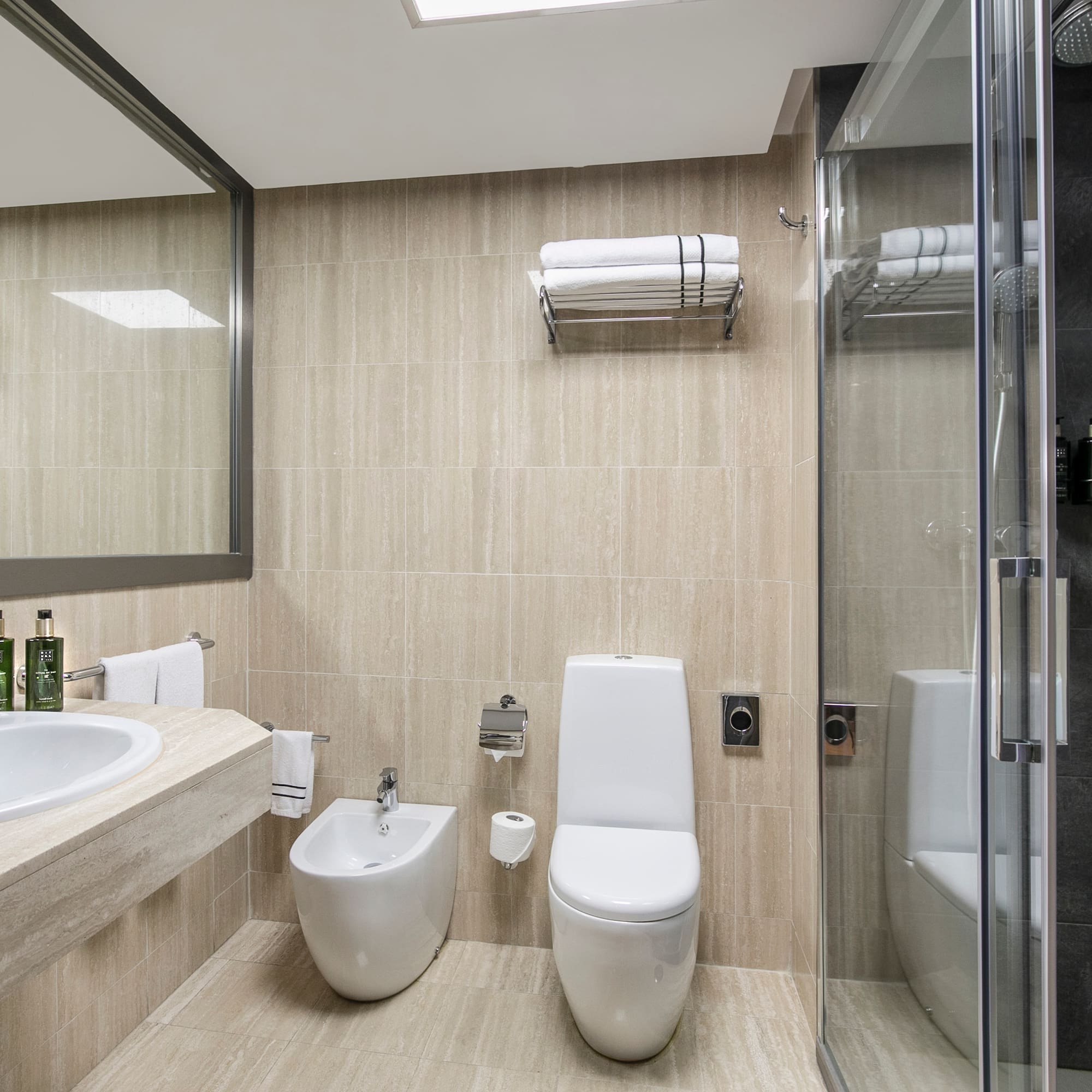 a bathroom with a shower and toilet