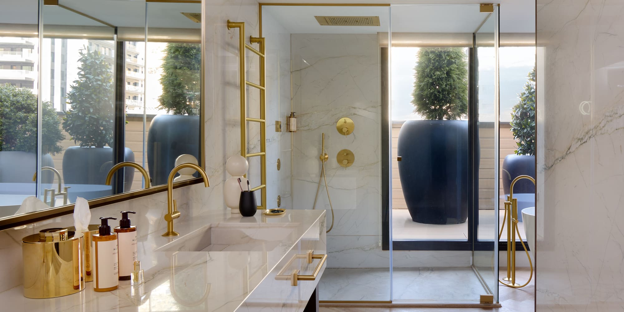 a bathroom with a shower and a large tub