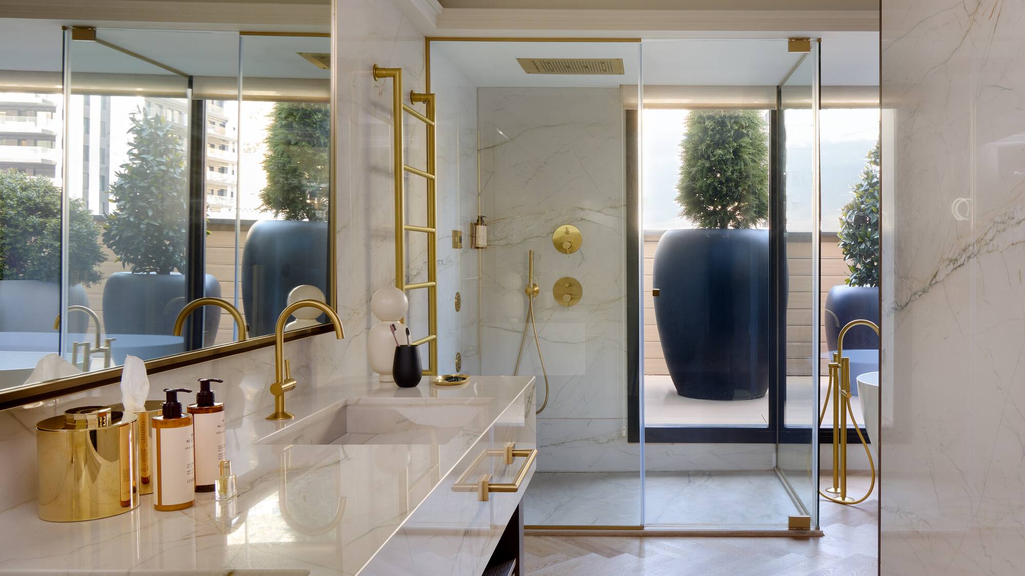 a bathroom with a shower and a large tub