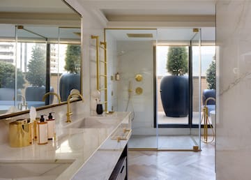 a bathroom with a shower and a large tub