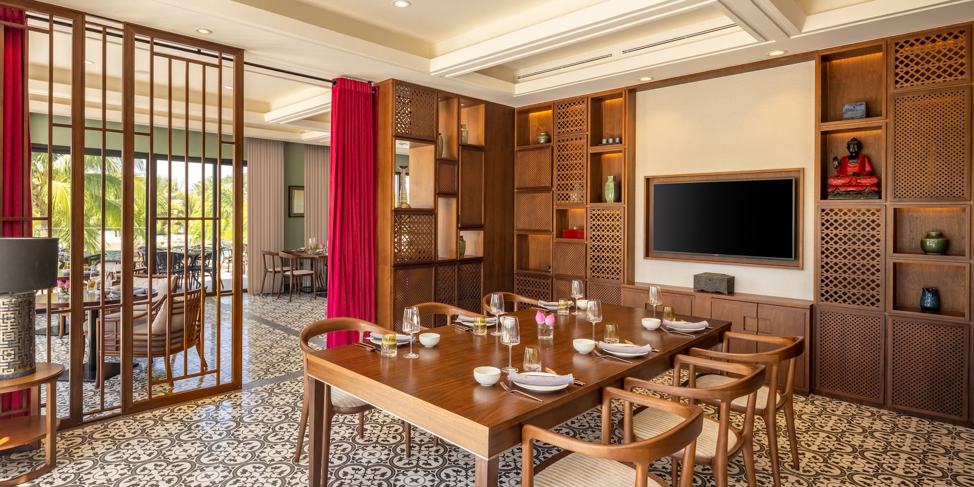 a dining room with a tv and a table
