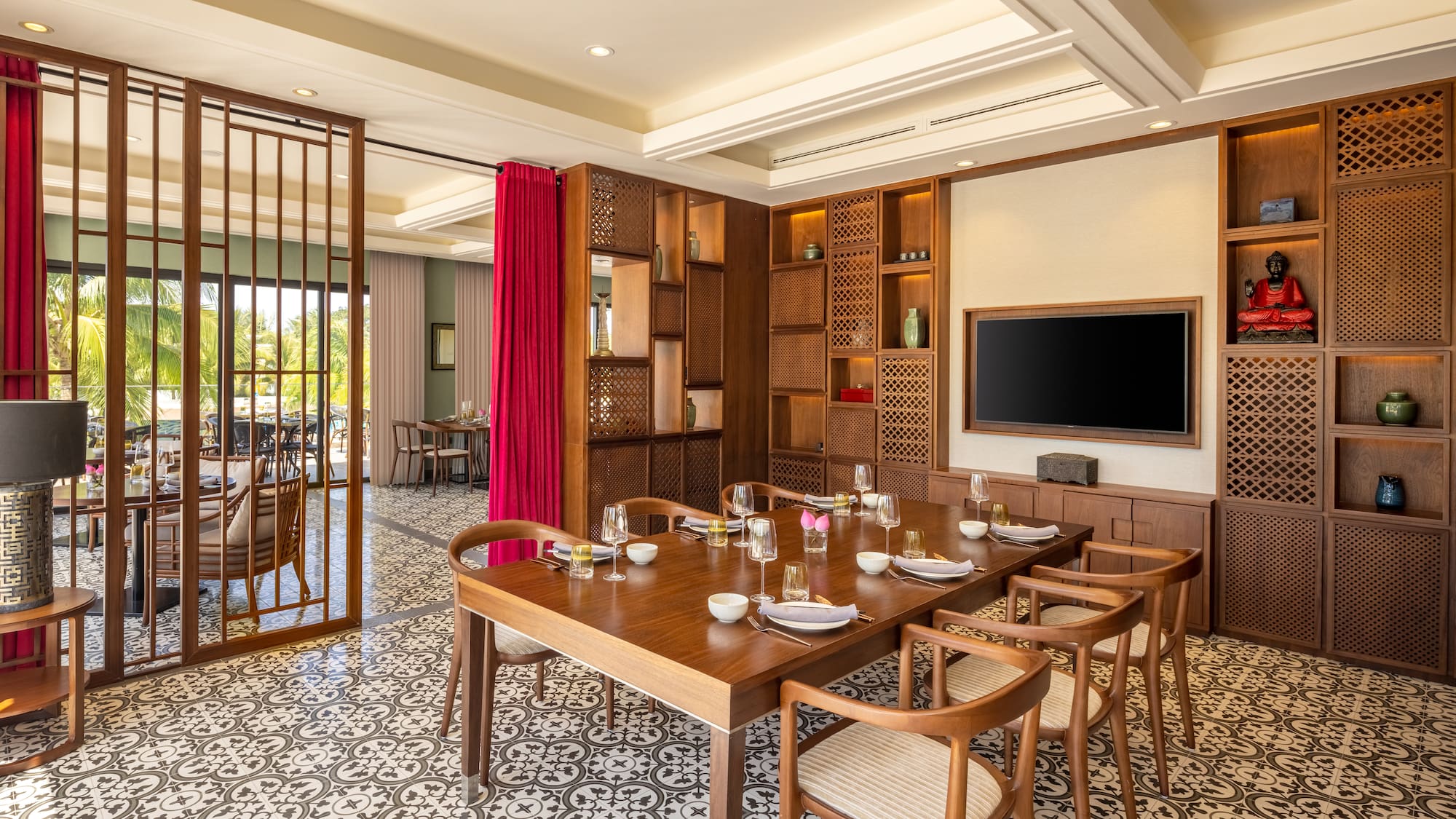 a dining room with a tv and a table