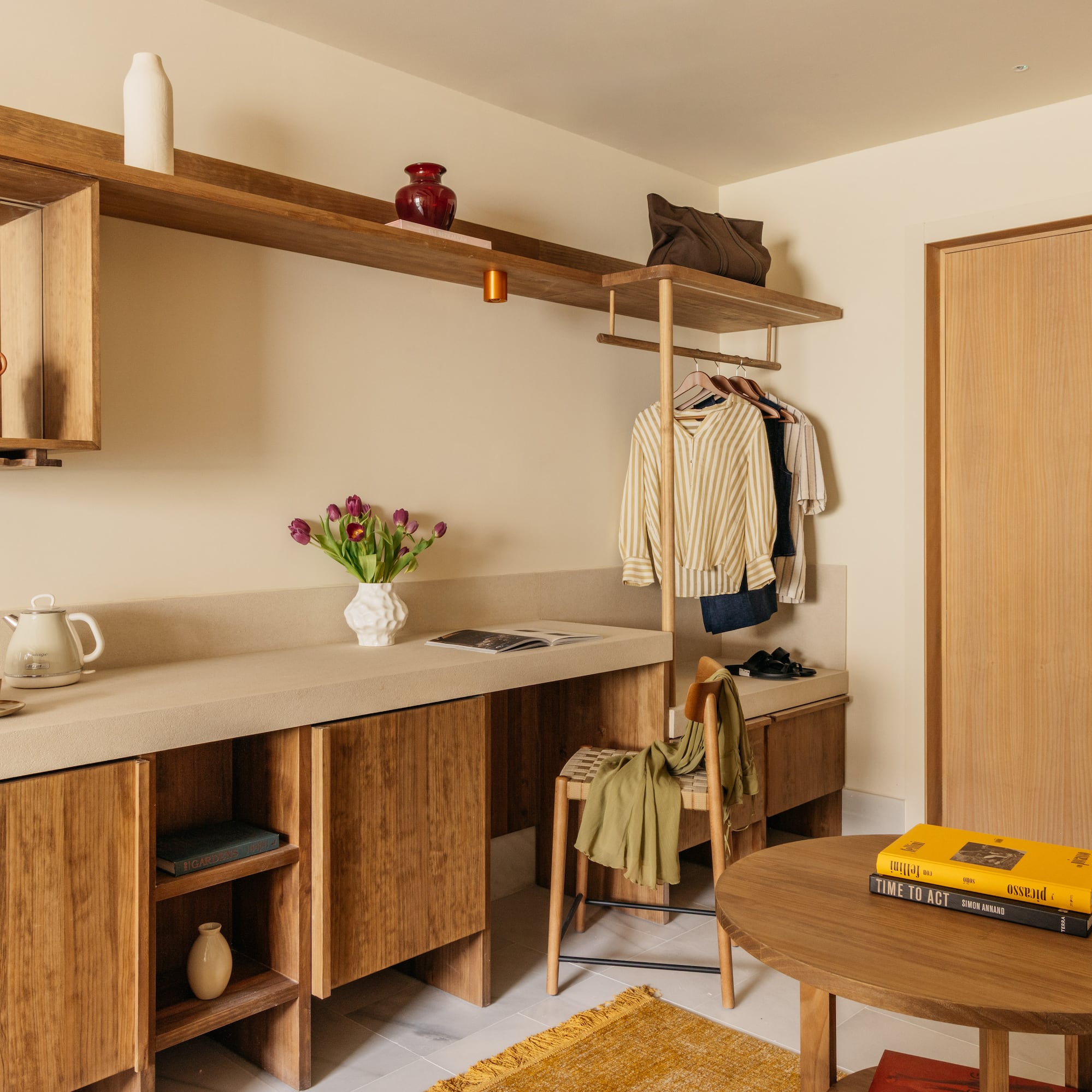 a room with a table and shelves