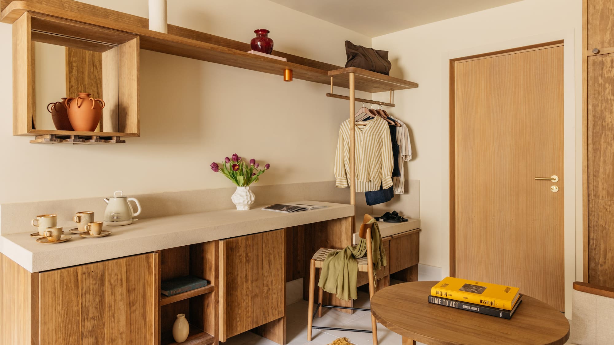 a room with a table and shelves