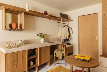 a room with a table and shelves