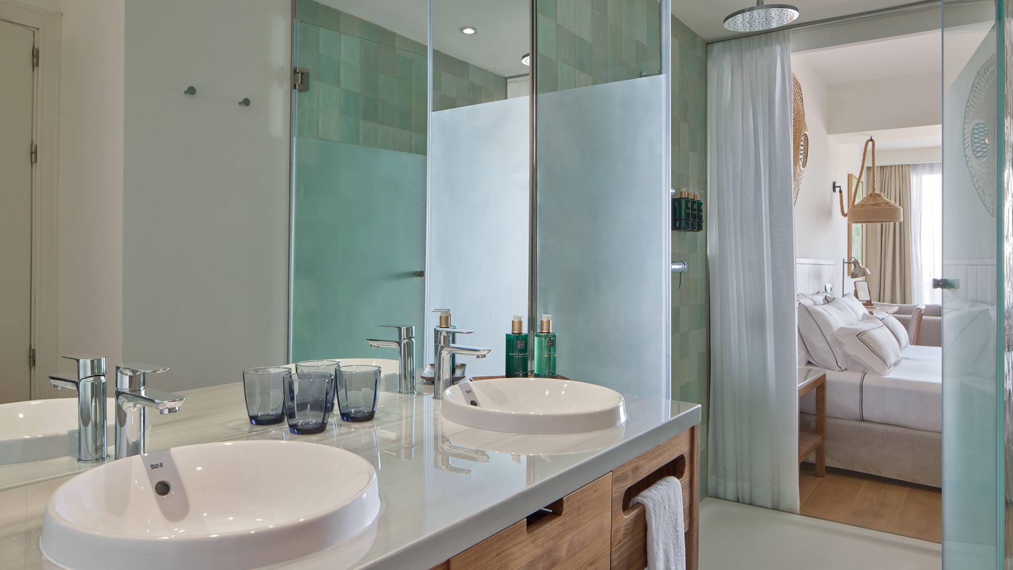 a bathroom with a shower and two sinks