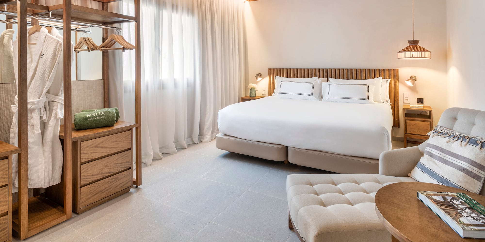 a bedroom with a bed and a chair