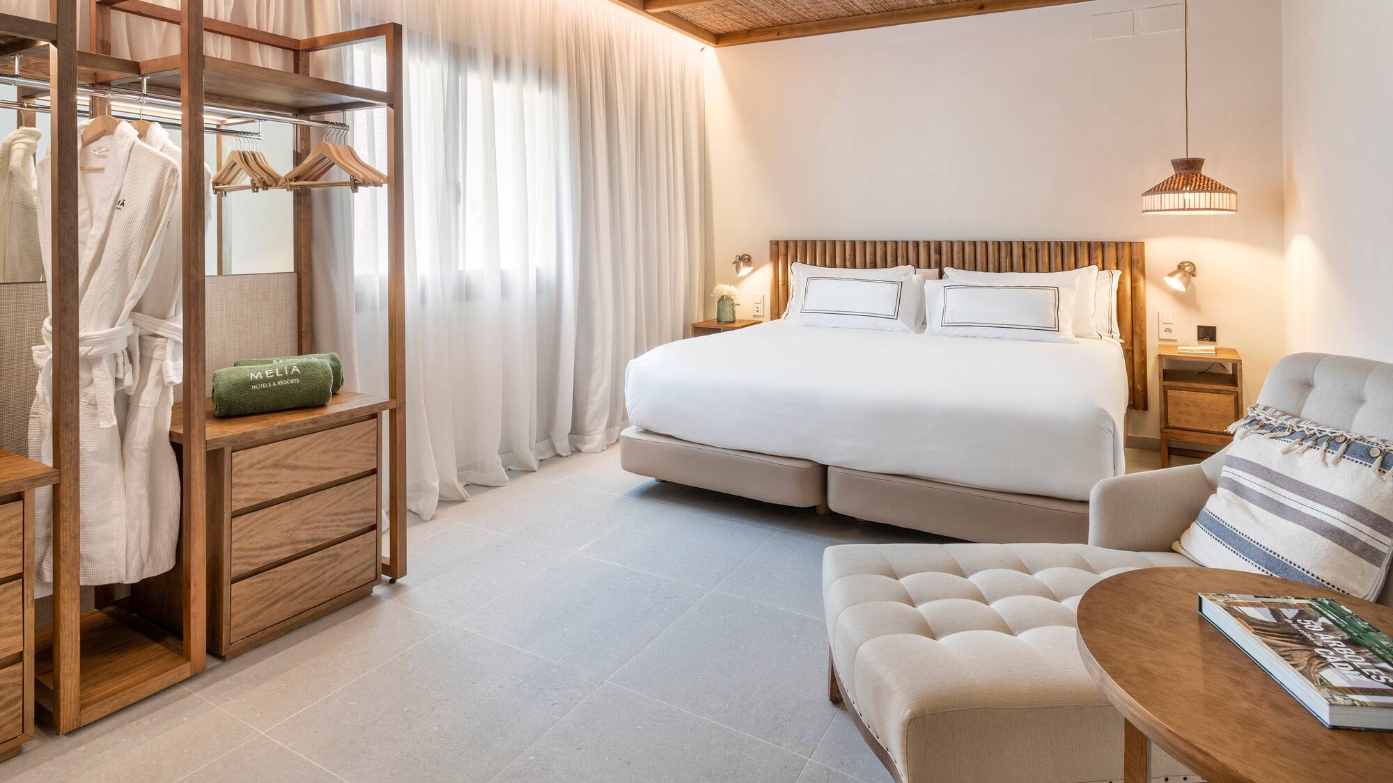 a bedroom with a bed and a chair