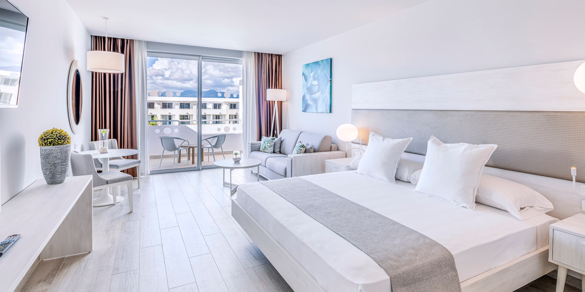 a bedroom with a bed and a couch