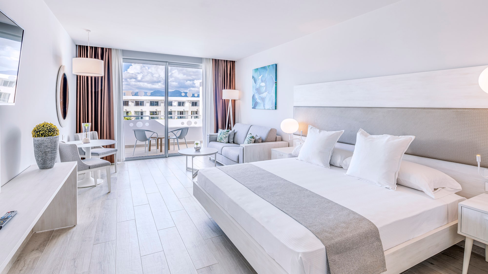 a bedroom with a bed and a couch