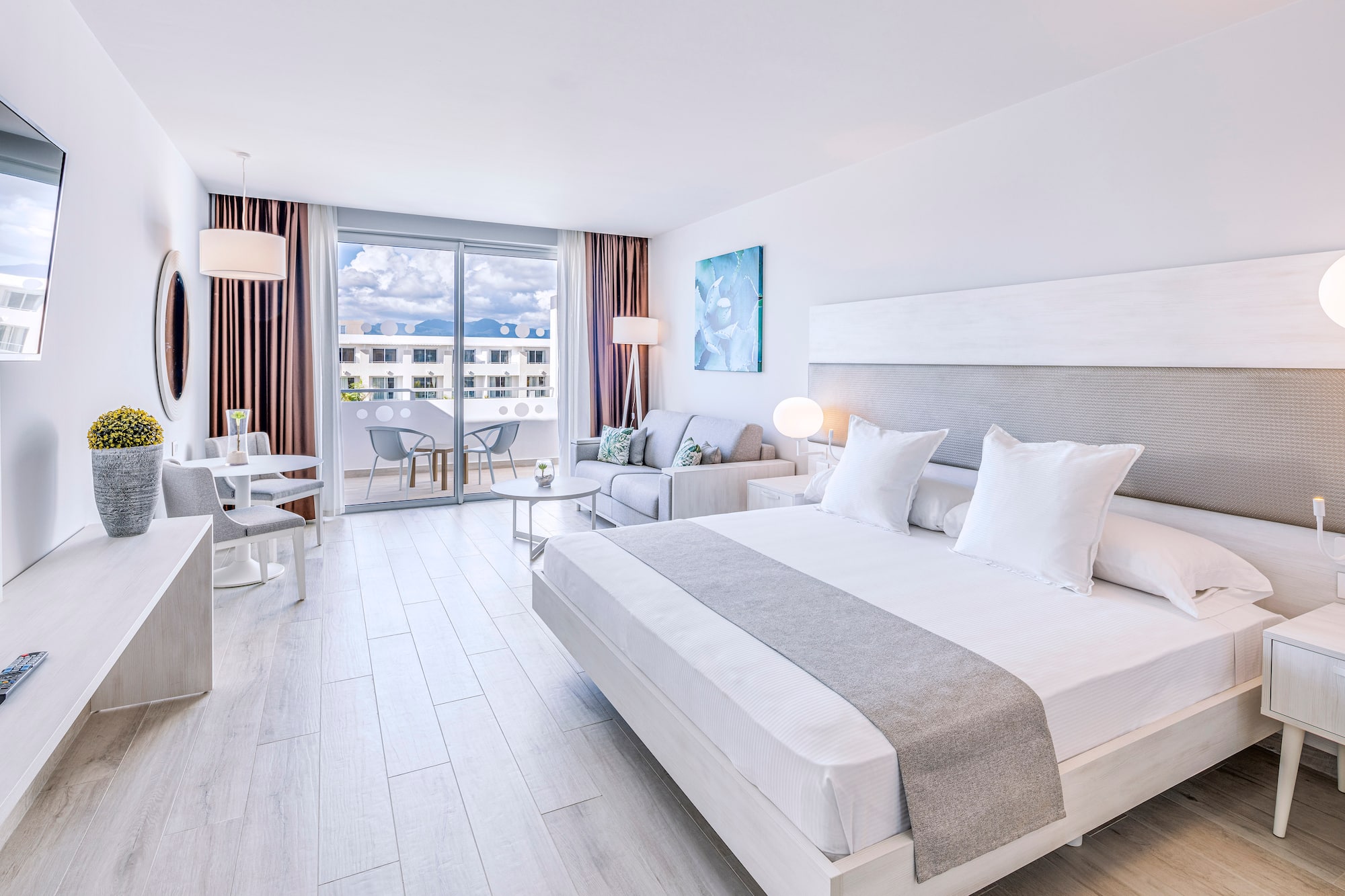 a bedroom with a bed and a couch