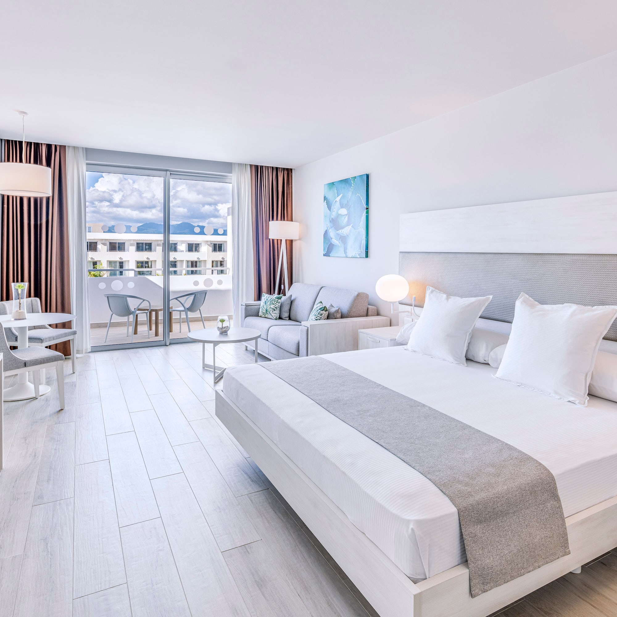 a bedroom with a bed and a couch