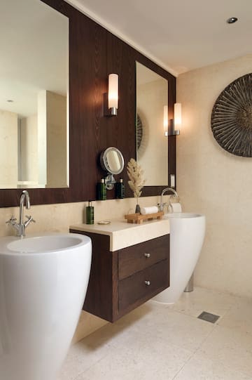 a bathroom with a sink and mirror