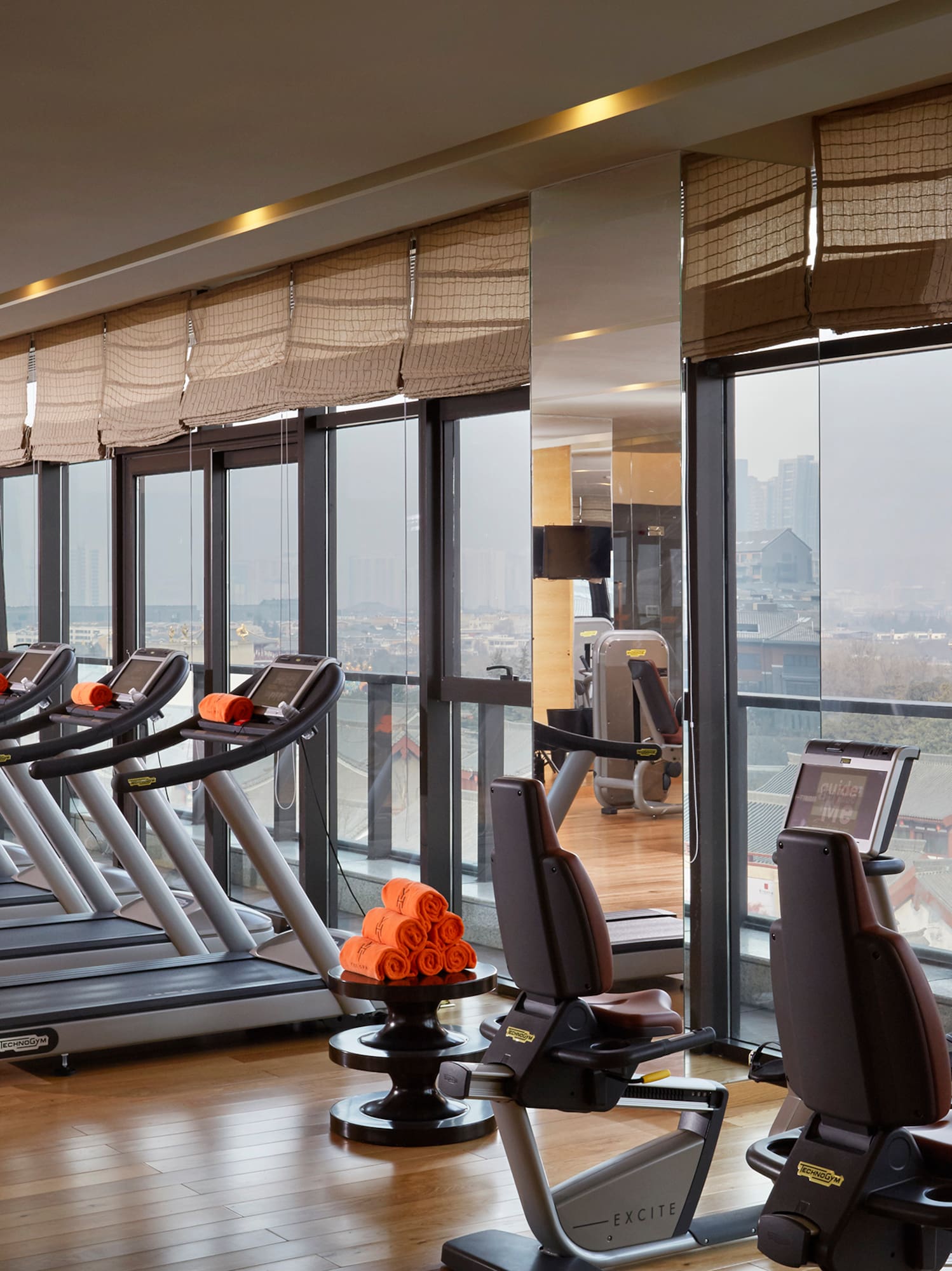 a room with treadmills and exercise equipment