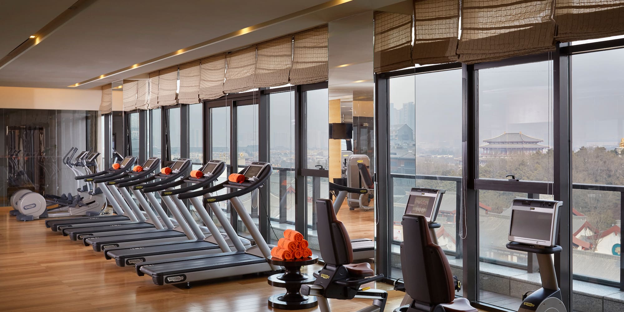 a room with treadmills and exercise equipment