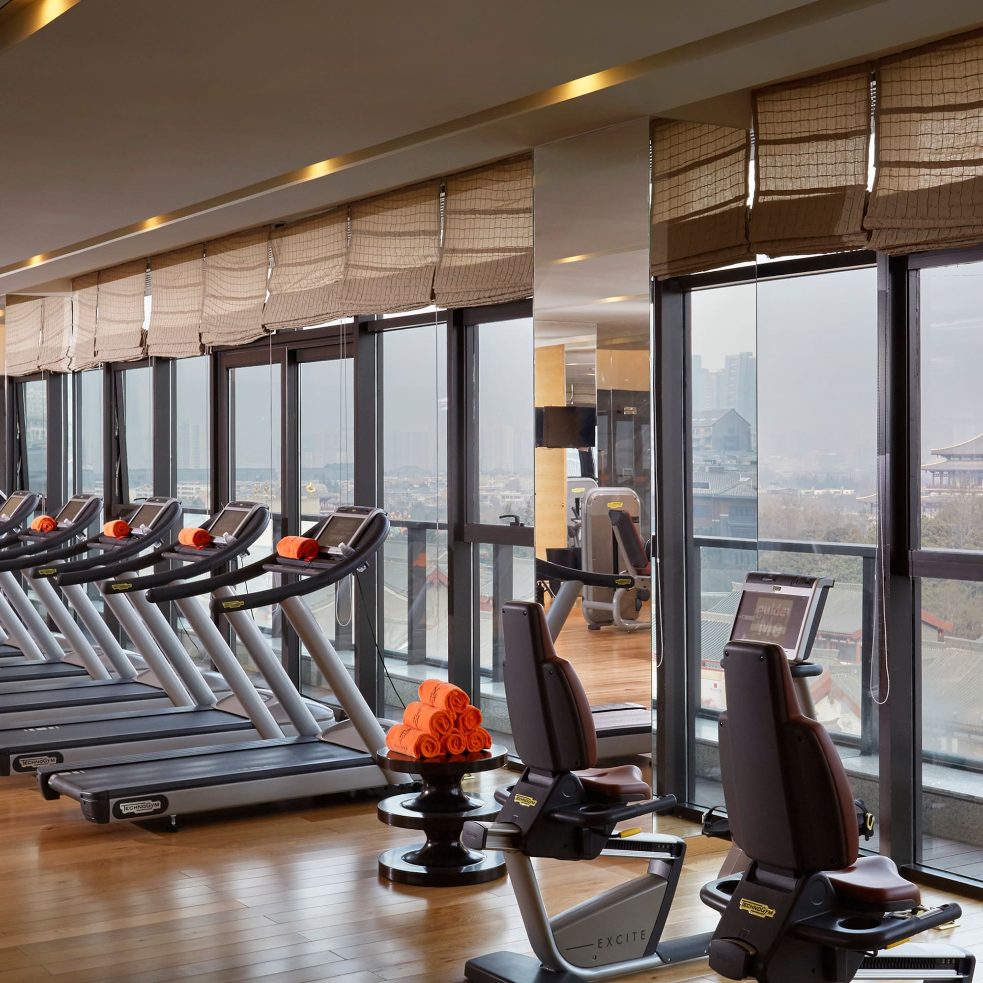 a room with treadmills and exercise equipment