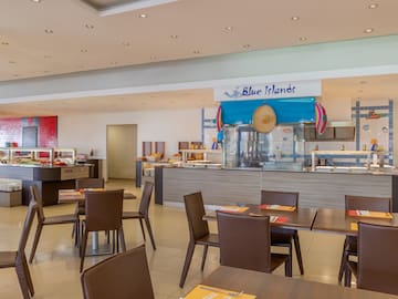 a restaurant with tables and chairs