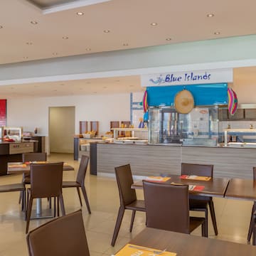 a restaurant with tables and chairs