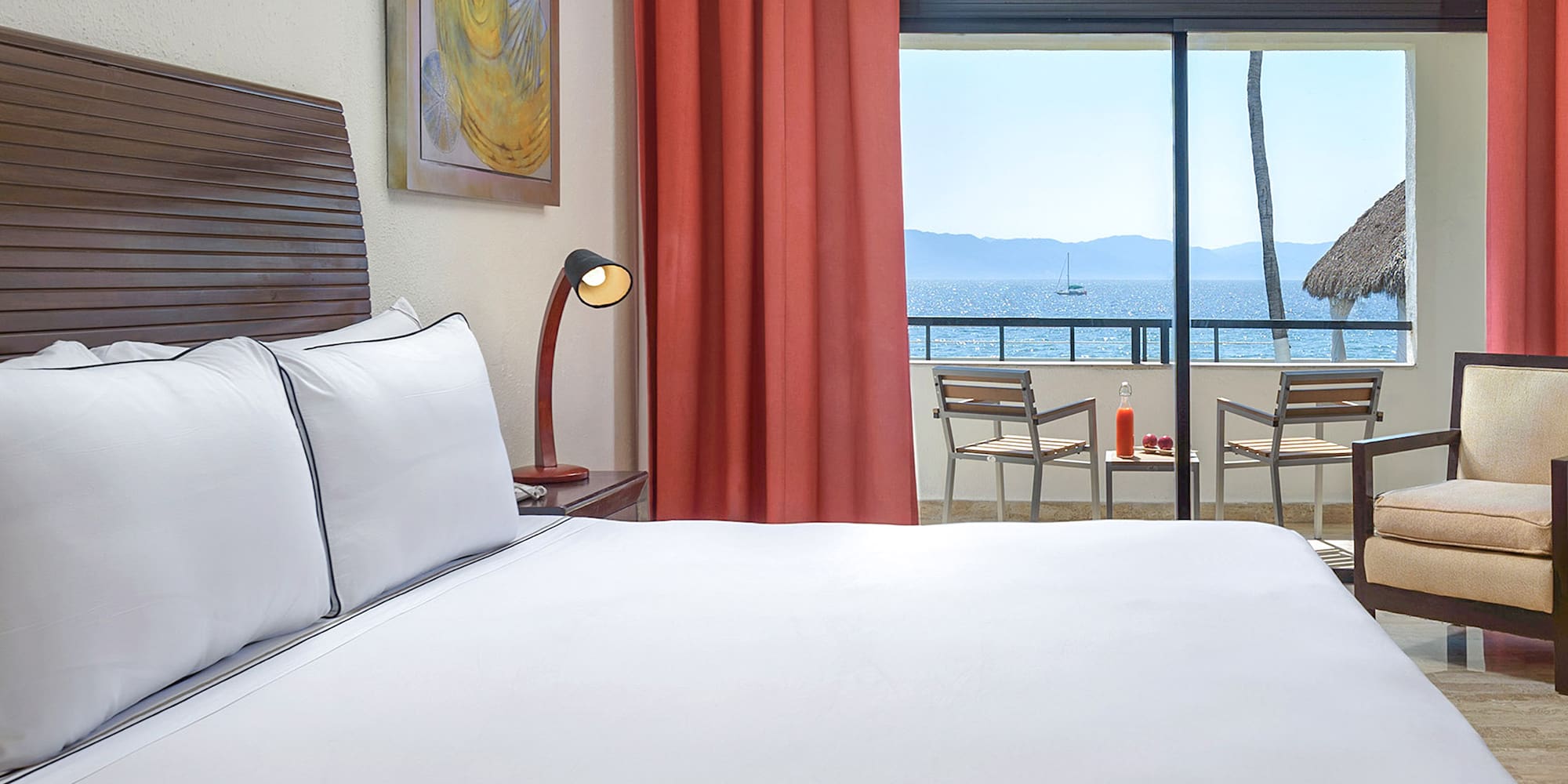 a bed with a view of the ocean