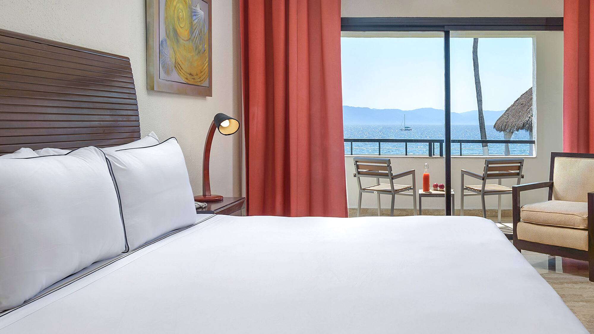 a bed with a view of the ocean