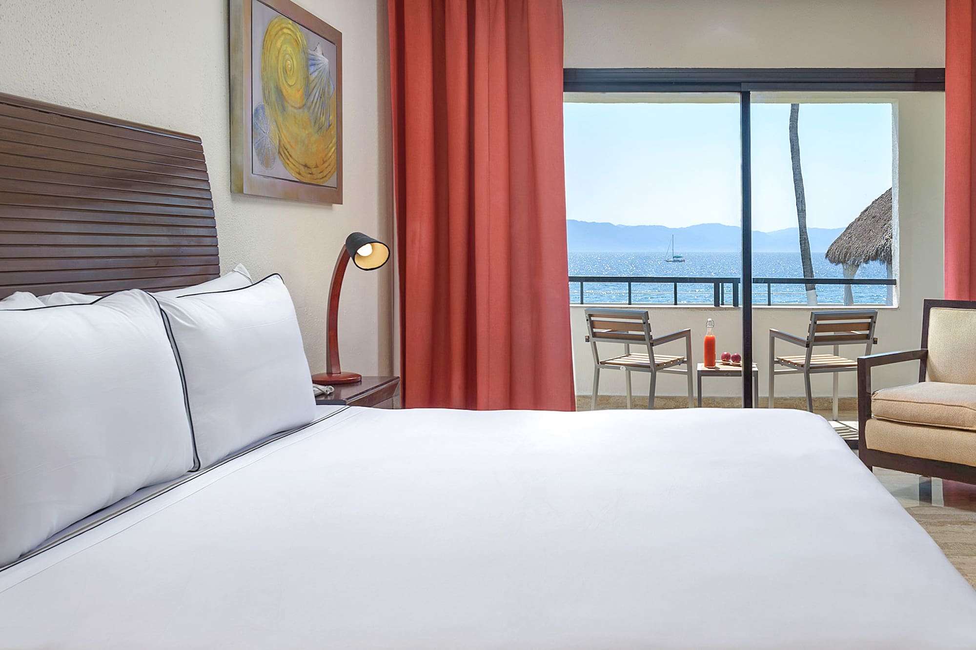 a bed with a view of the ocean