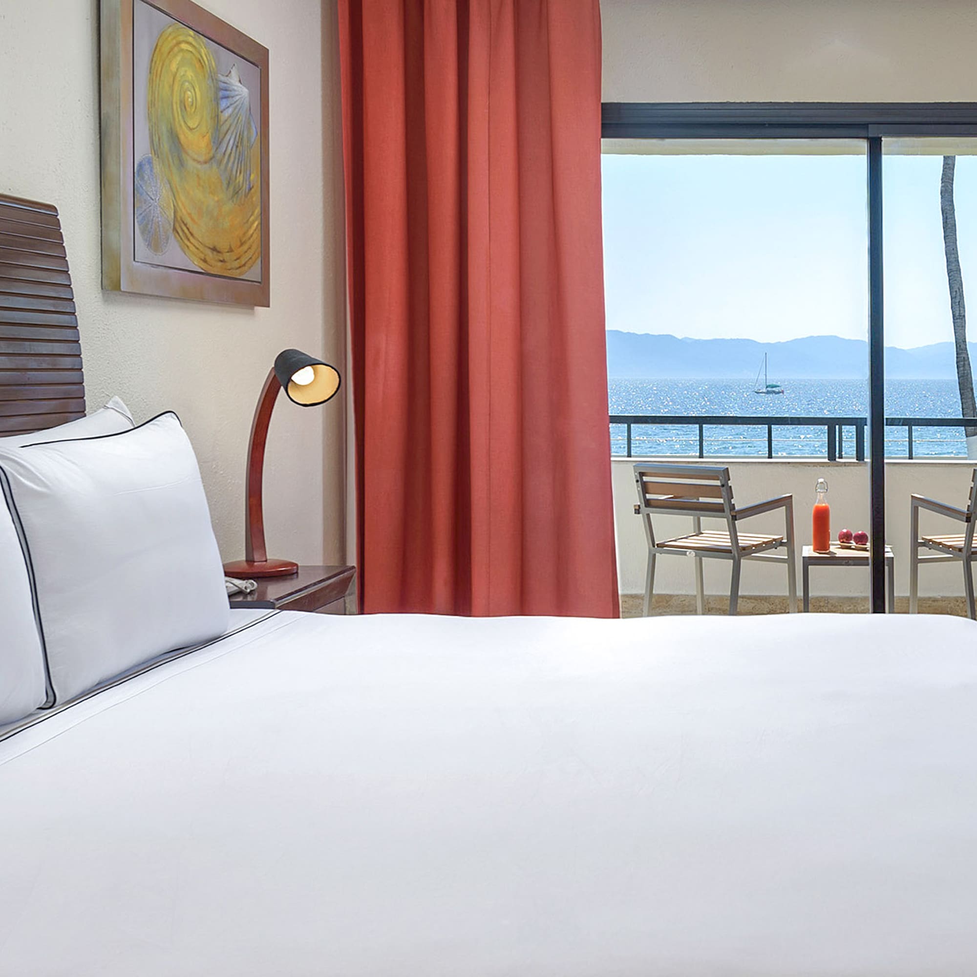 a bed with a view of the ocean