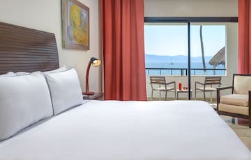 a bed with a view of the ocean