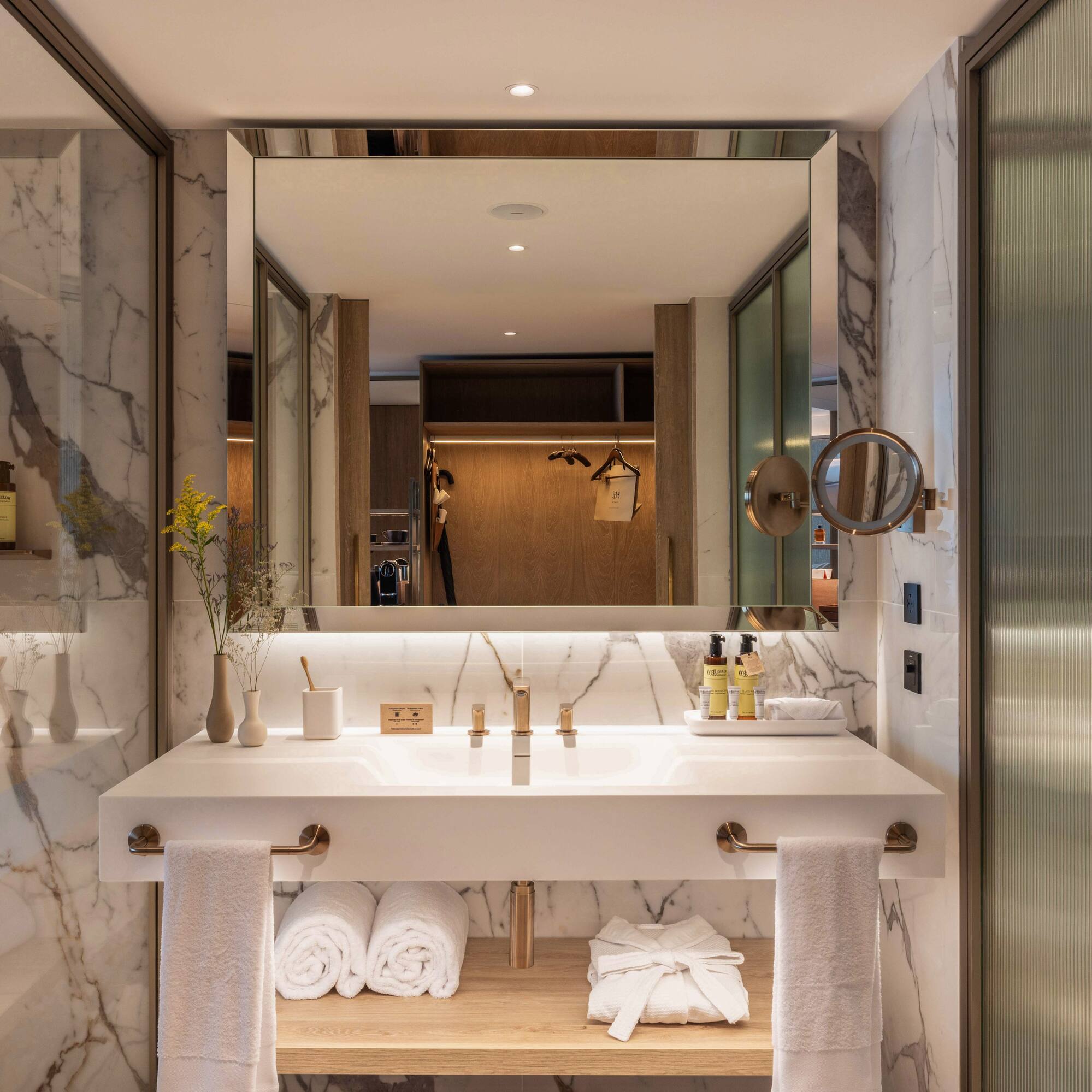 a bathroom with a large mirror and a sink