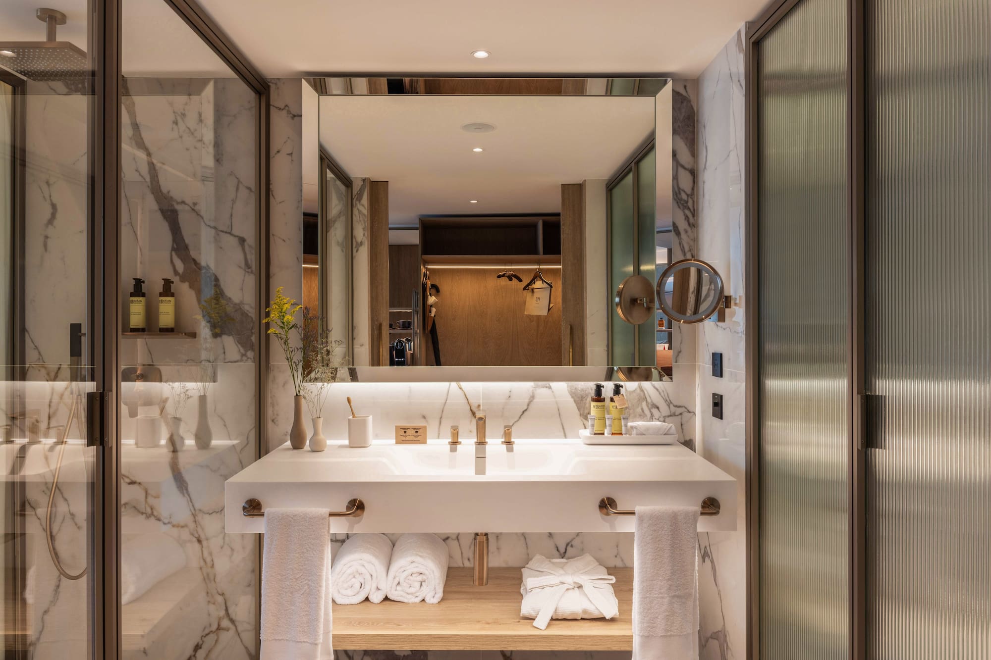 a bathroom with a large mirror and a sink