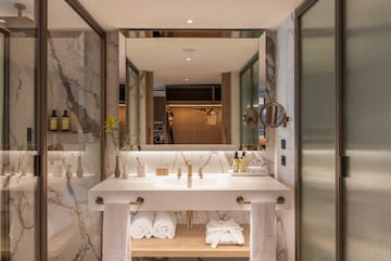 a bathroom with a large mirror and a sink