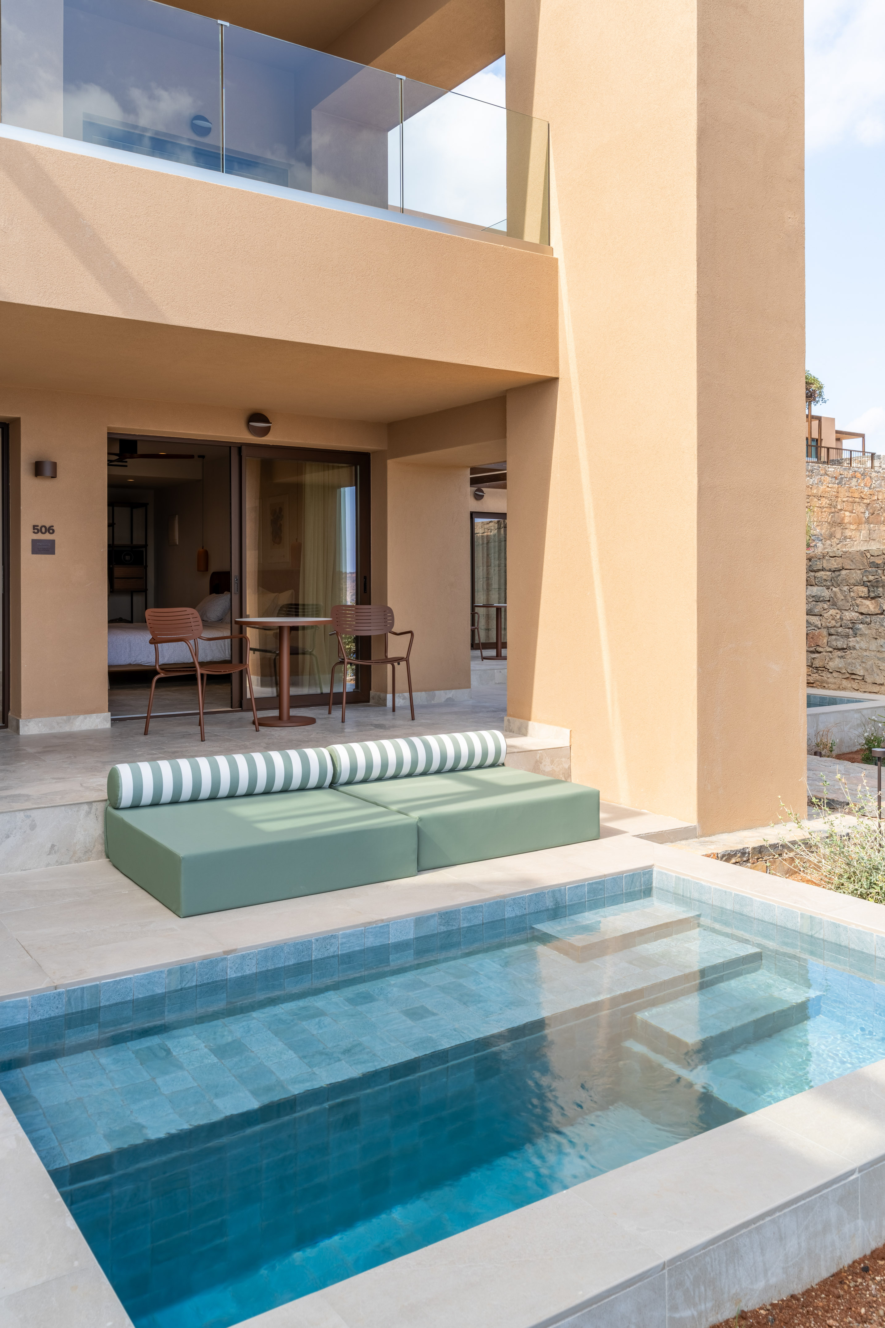 Luxury hotel suite 506 with private plunge pool and outdoor patio lounge.