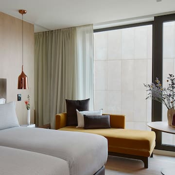 a room with two beds and a couch