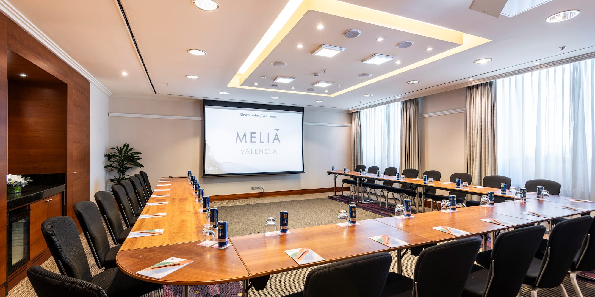 a room with a large table and chairs