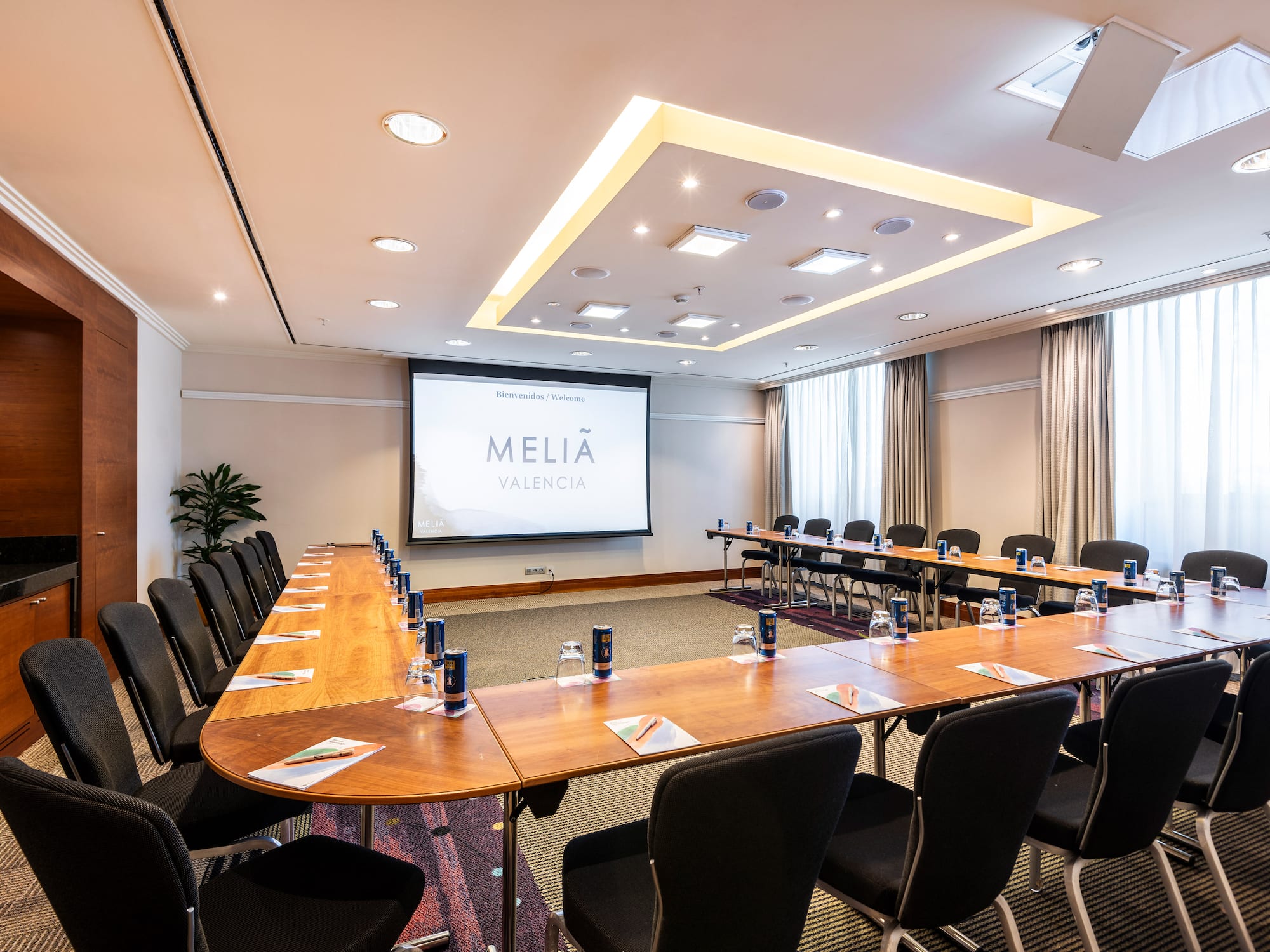 a room with a large table and chairs