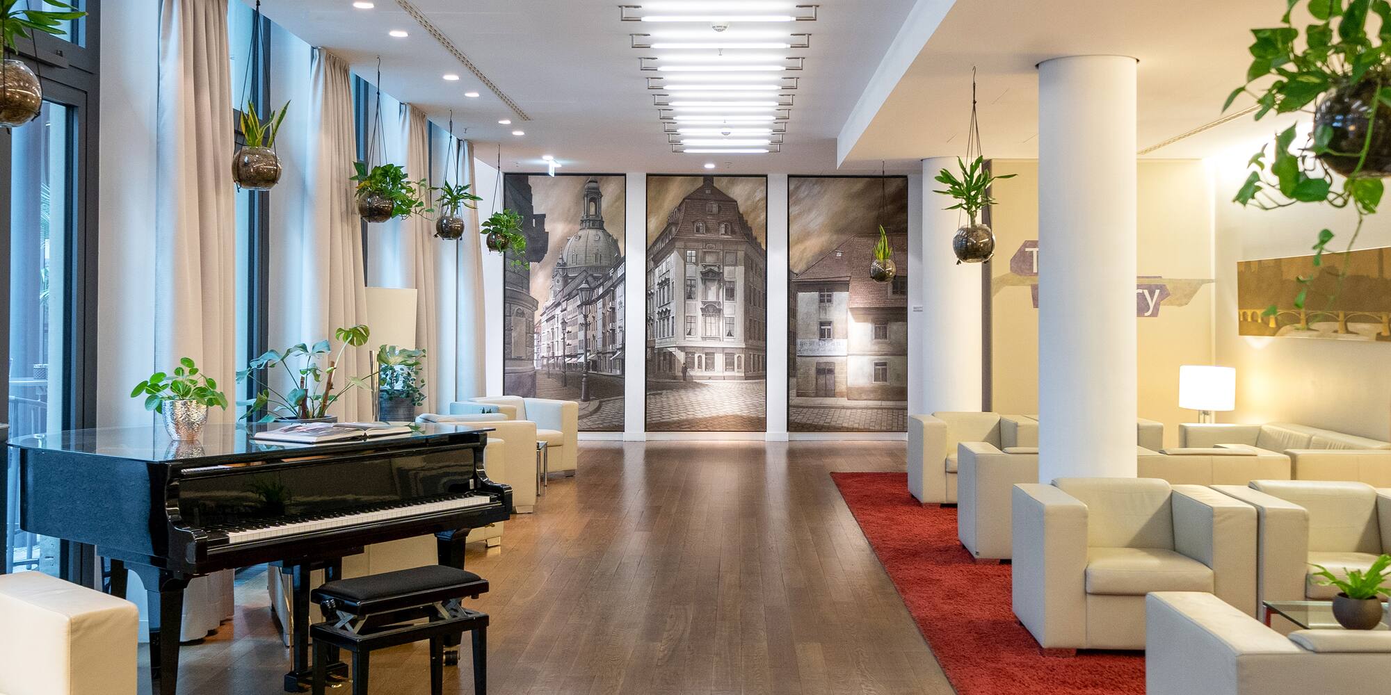 a room with a piano and chairs