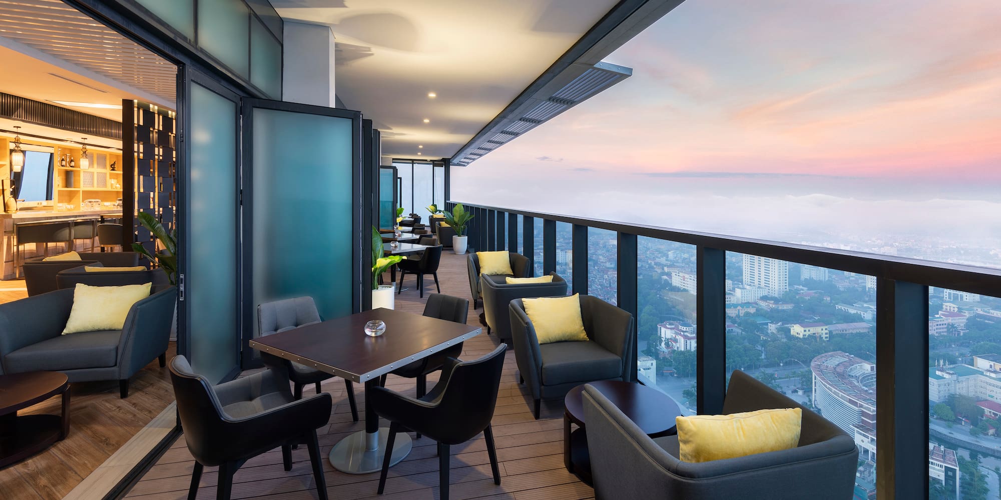 a balcony with tables and chairs