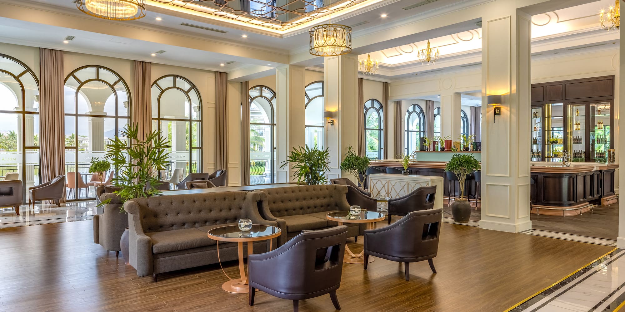 a room with couches and tables and chairs