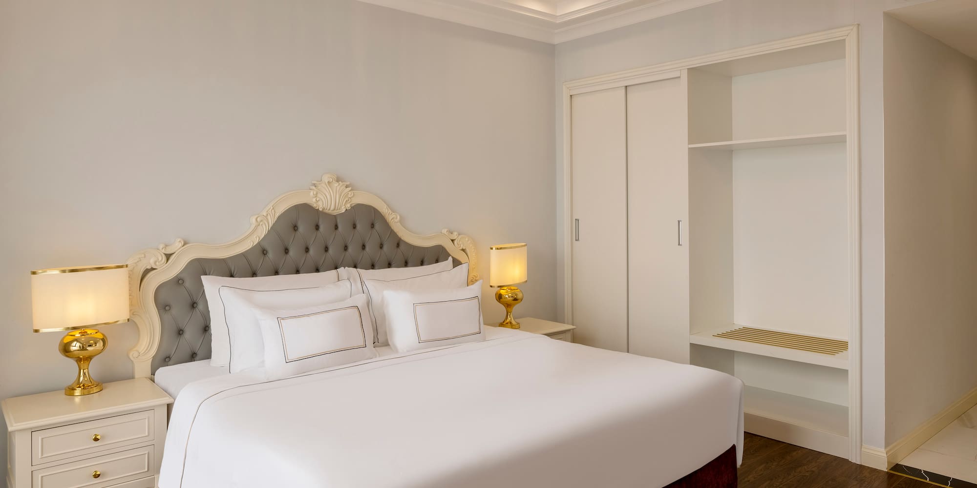 a bed with a chandelier in the middle