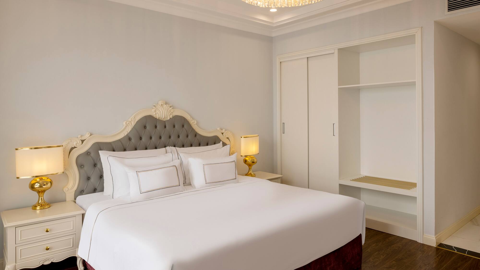 a bed with a chandelier in the middle