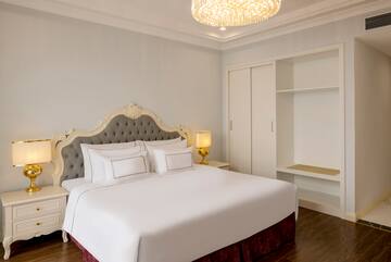 a bed with a chandelier in the middle