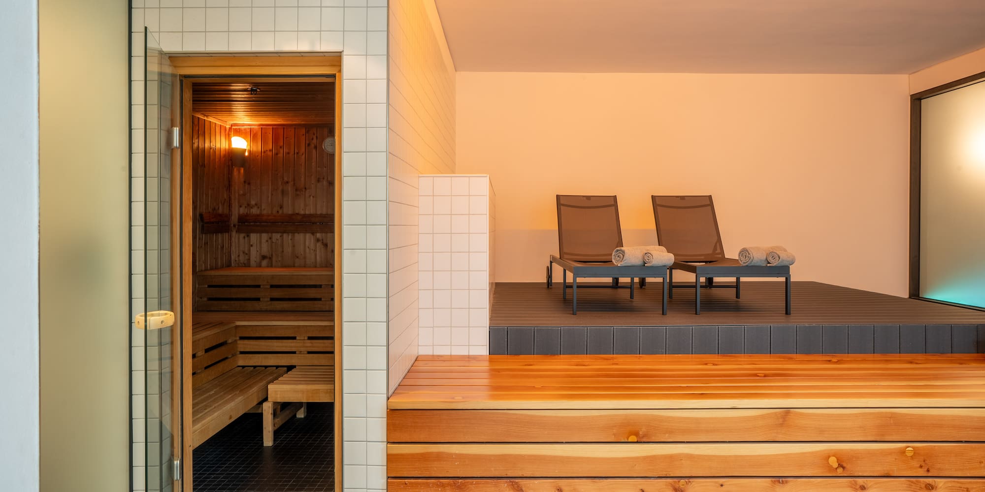 a sauna with chairs in the background