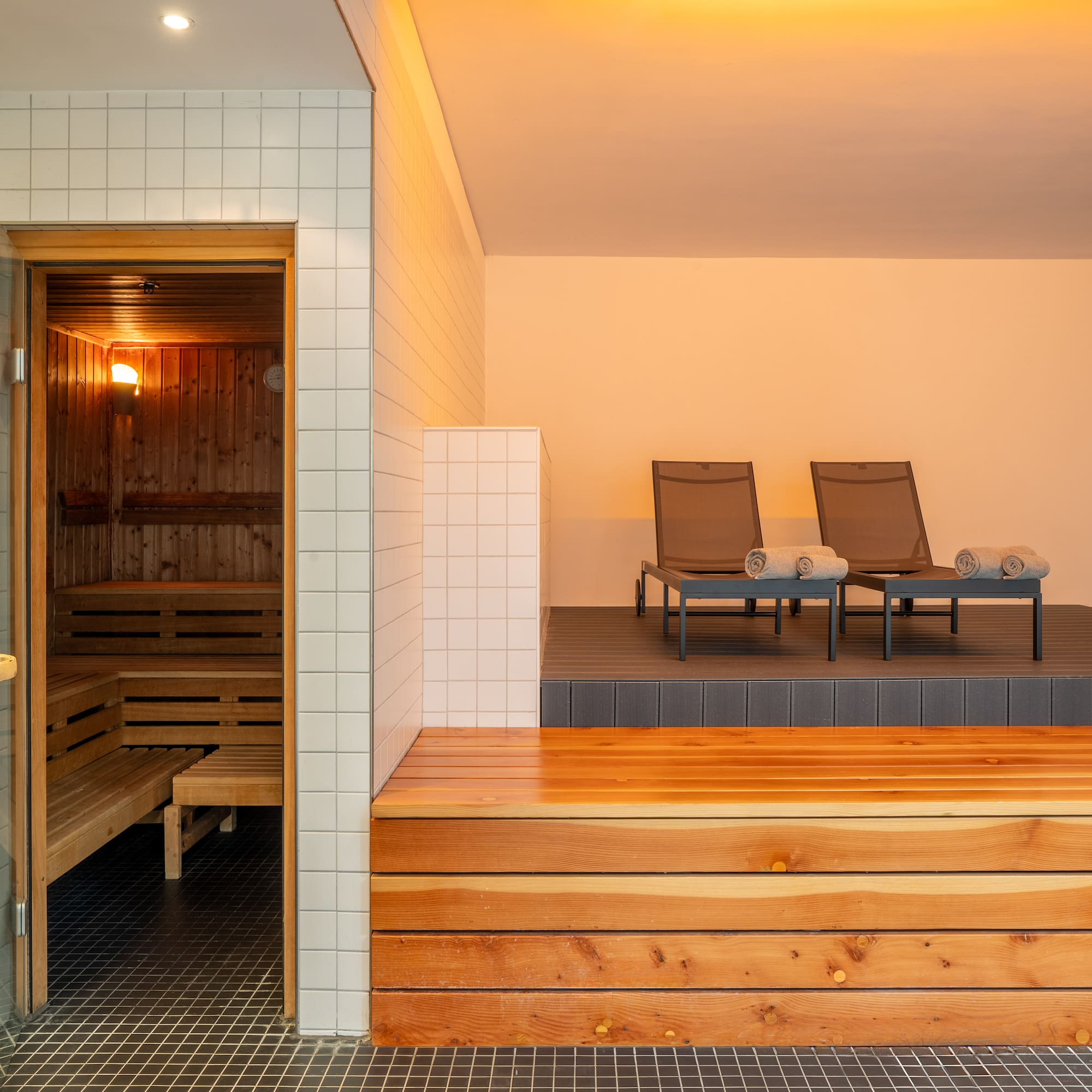 a sauna with chairs in the background